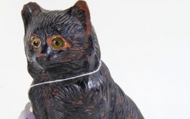 Bretby pottery cat, with a black glaze and modelled in a seated position, 17cm high
