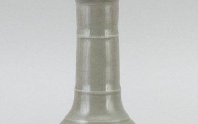 CHINESE GUAN WARE VASE In mallet form, with a concentric ring design. Height 6.75".