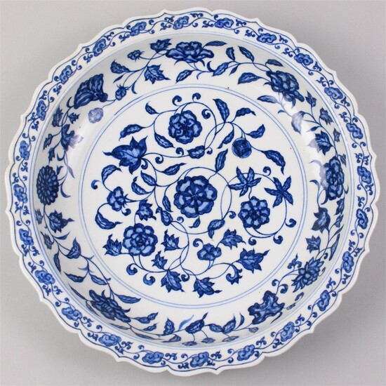 CHINESE UNDERGLAZE BLUE AND WHITE LOW BOWL WITH BARBED RIM