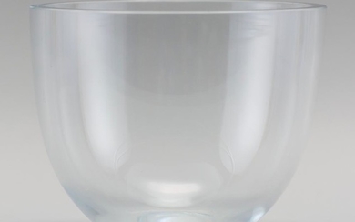 CLEAR ART GLASS BOWL With thick walled sides and a flat rim. Signed on " Strömbergshyttan" base. Height 6". Diameter 7.5".