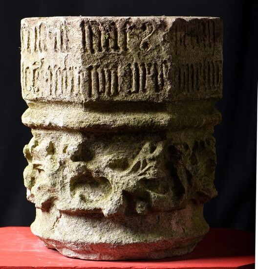 Carved sandstone column element. The lower part is circular and decorated with stylised foliage and the upper part is octagonal and decorated with Gothic inscriptions. France, late 13th or early 14th century. H:38 W:31.5 D:32 cm. Accidents.