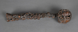 Chinese boxwood ruyi scepter, the head and contoured shaft carved and pierced with pomegranate, 13