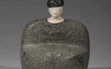 Composite statuette. The character is sitting, dressed in...