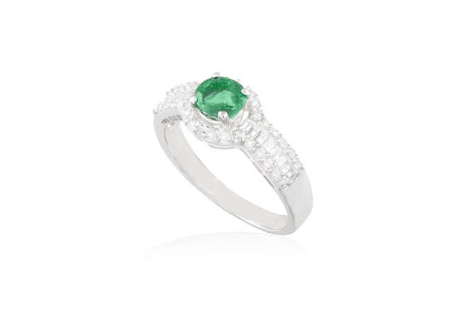 Description AN EMERALD AND DIAMOND RING The circular-cut emerald...