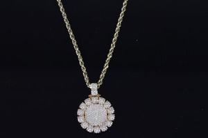 Diamond cluster pendant, heavy diamond set circular pendant, bombe set diamond centre, 14 clusters of diamonds to the...