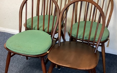 ERCOL: A set of four stick back chairs.