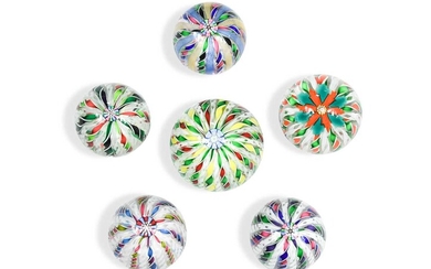 Five glass paperweights, probably by John Deacons