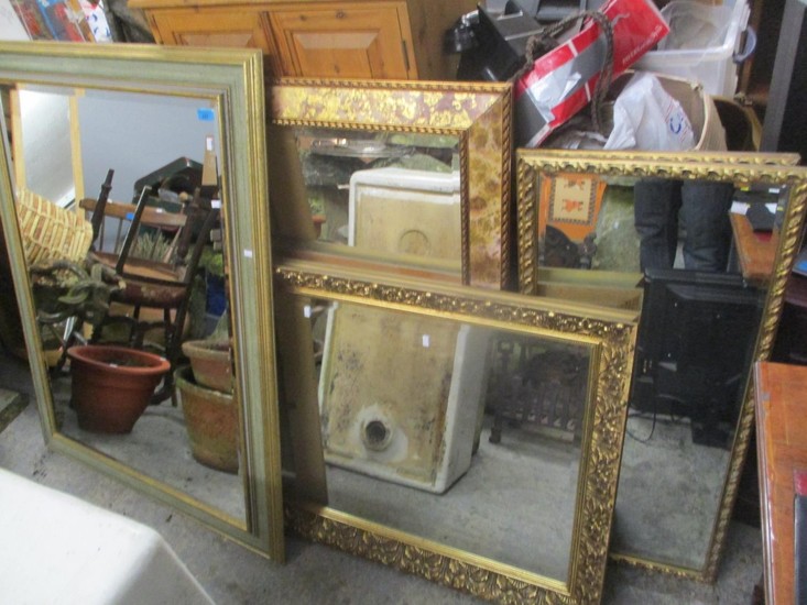 Five mixed gilded wall hanging mirrors to include one having...