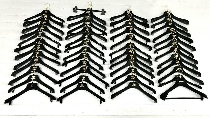 GROUPING OF CHANEL CLOTHING HANGERS