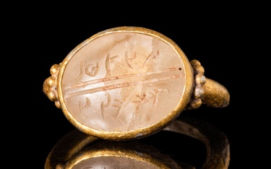HOLY LANDS SILVER-GILT RING WITH ROCK CRYSTAL INTAGLIO WITH ARAMAIC...