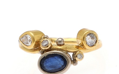 Josephine Bergsøe: A sapphire and diamond ring set with an oval and a circular-cut sapphire and a pear shaped and two brilliant-cut diamonds mounted in 18k gold