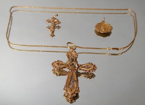 Lot of gold jewelry including, gold cross and...