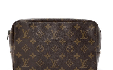 NOT SOLD. Louis Vuitton: A "Toiletry Pouch" made of brown monogram canvas with one zipped...