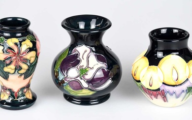 MOORCROFT; three small vases, including an example decorated in the...