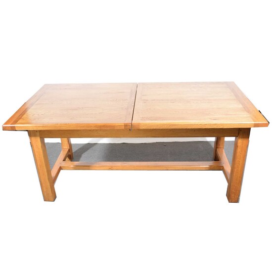 Modern oak draw-leaf dining table.