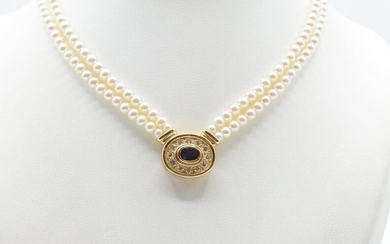 Necklace of 2 rows of pearls with charm attached and clasp in 18 ct yellow gold set with 12 brilliants +/- 1 ct and 1 sapphire (37 cm)