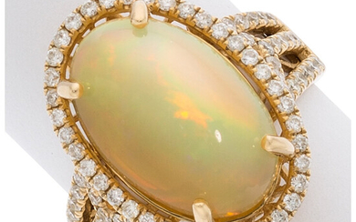Opal, Diamond, Gold Ring The ring features an oval-shaped...