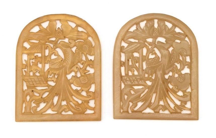 PAIR OF CHINESE OPENWORK-CARVED MUTTONFAT JADE PLAQUES Both depict phoenix in a landscape. Heights 3". Lengths 2.25".