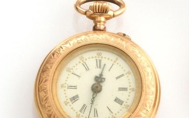 POCKET WATCH in 750-thousandths yellow gold, the blue breguet hands, the obverse chiselled with a leaf motif features the initials LM. Diameter: 2.8 cm. Gross weight: 18.9 gr. A yellow gold pocket watch.