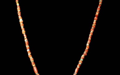 PTOLEMAIC PERIOD CARNELIAN NECKLACE WITH GOLD PENDANT
