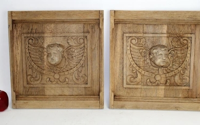Pair French oak panels with carved cherub maks