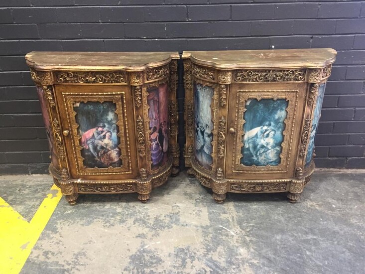 Pair of Gilt French Style Cabinets, each with a single door, with applied scroll decoration & figural panels