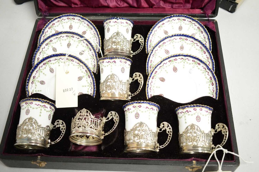 Royal Worcester part coffee set with silver cup receivers.