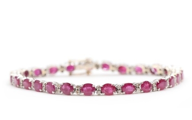 Ruby and diamond bracelet set with numerous faceted rubies and brilliant-cut diamonds totalling app. 0.26 ct., mounted in 18k white gold. L. 17.8 cm.