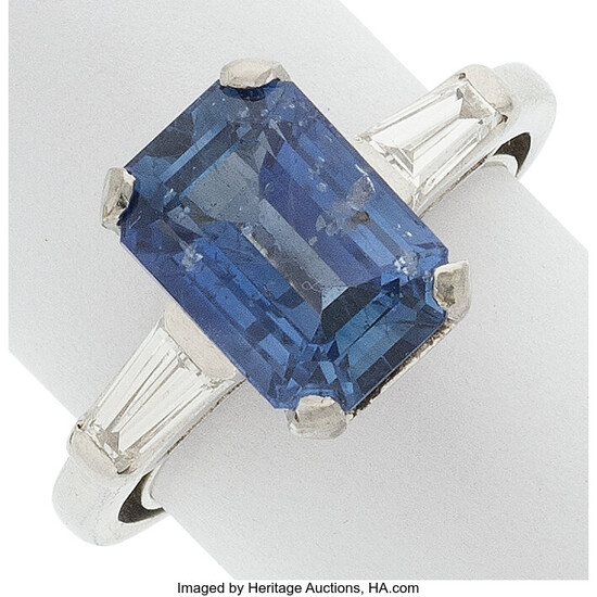 Sapphire, Diamond, Platinum Ring Stones: Emerald-cut sapphire weighing approximately...