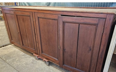 (See Lot 525) Large early 20th century stained pine four doo...