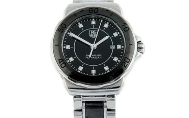 TAG HEUER - a Formula 1 bracelet watch. Stainless steel case with black ceramic calibrated bezel.