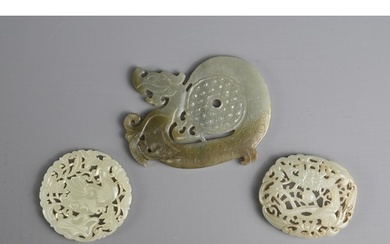 THREE CHINESE JADE PENDANTS. To include a circular carved an...