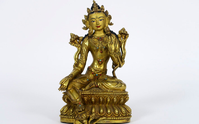 TIBET or NEPAL - ca 1900 sculpture in Mongolian style : "Tara" sitting on a double lotus tree, with a foot resting on a lotus flower, with polychromed face and inlaid cabochons in turquoise and coral - 18 x 10 cm prov : collection family Dhakhwa -...