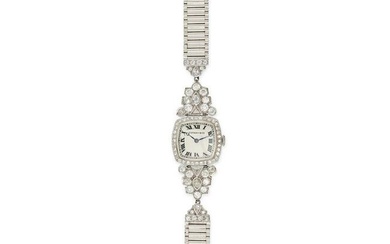 TIFFANY & CO - A VINTAGE DIAMOND COCKTAIL WATCH in platinum and 14ct white gold, the dial with Ro...