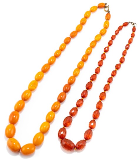 TWO VINTAGE GRADUATED AMBER BEAD NECKLACES; 8-16mm ovoid butterscotch beads, 54cm, and 6-15mm faceted ovoid beads, 45cm.