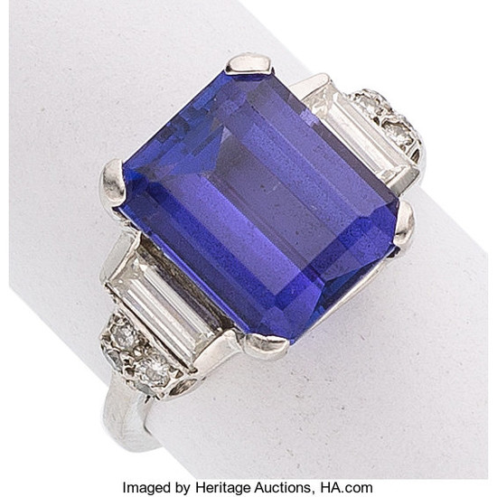 Tanzanite, Diamond, Platinum Ring The ring features an emerald-cut...