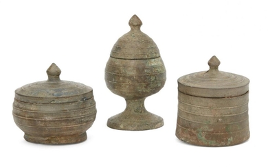 Three Chinese bronze miniature votive covered vessels, Late Six dynasties...