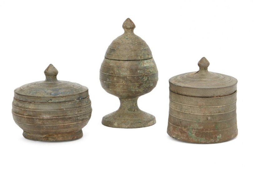 Three Chinese bronze miniature votive covered vessels, Late Six dynasties...