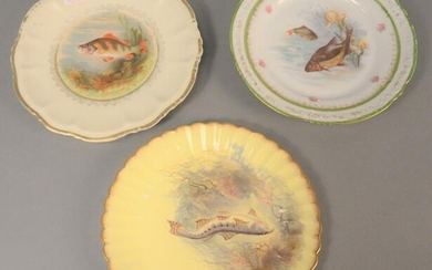 Three sets of hand-painted fish plates to include eight
