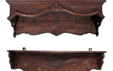 Two French Provincial Normandy Carved Walnut Coat/Kitchen Racks, 19th c., the flat shelf top with