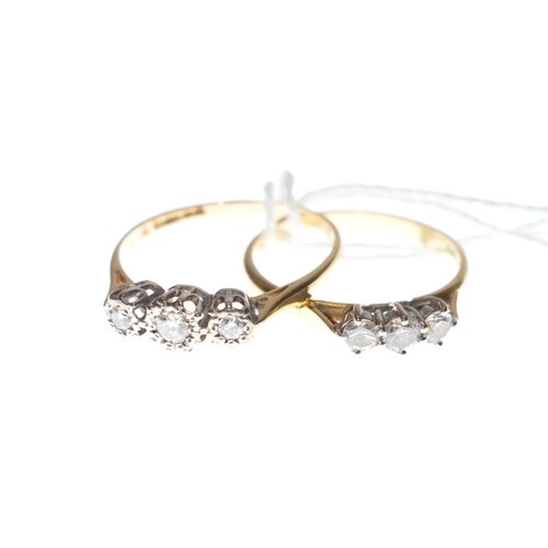 Two diamond three stone rings in 18ct gold. Sizes 'O½...
