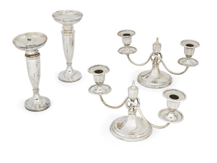 Two pairs of silver candlesticks, one pair...