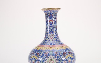 a famille rose vase with twining lotus and hidden Eight Treasures, symbolizing great fortune, from