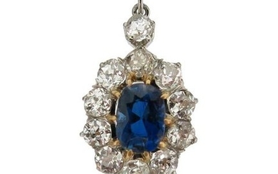 A sapphire and diamond cluster pendant, the oval-shaped...