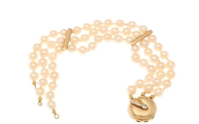 A three-string pearl bracelet set with numerous cultured pearls and a clasp set with a brilliant-cut diamond, mounted in 14k gold and white gold.