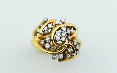 14K YELLOW AND WHITE GOLD AND DIAMOND RING. Low-dome, openwork...