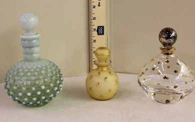 3 vintage perfume bottles with stoppers