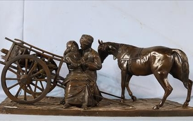 Bronze statue of man and woman with horse