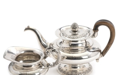 A Danish late Empire silver teapot and creamer. Maker Peter Petersen, Odense, trade licence 1834. H. 13.5–16.5 cm. (2)