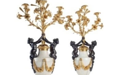 A PAIR OF FRENCH ORMOLU AND PATINATED BRONZE FIGURAL FOUR-LIGHT CANDELABRA, MID-19TH CENTURY
